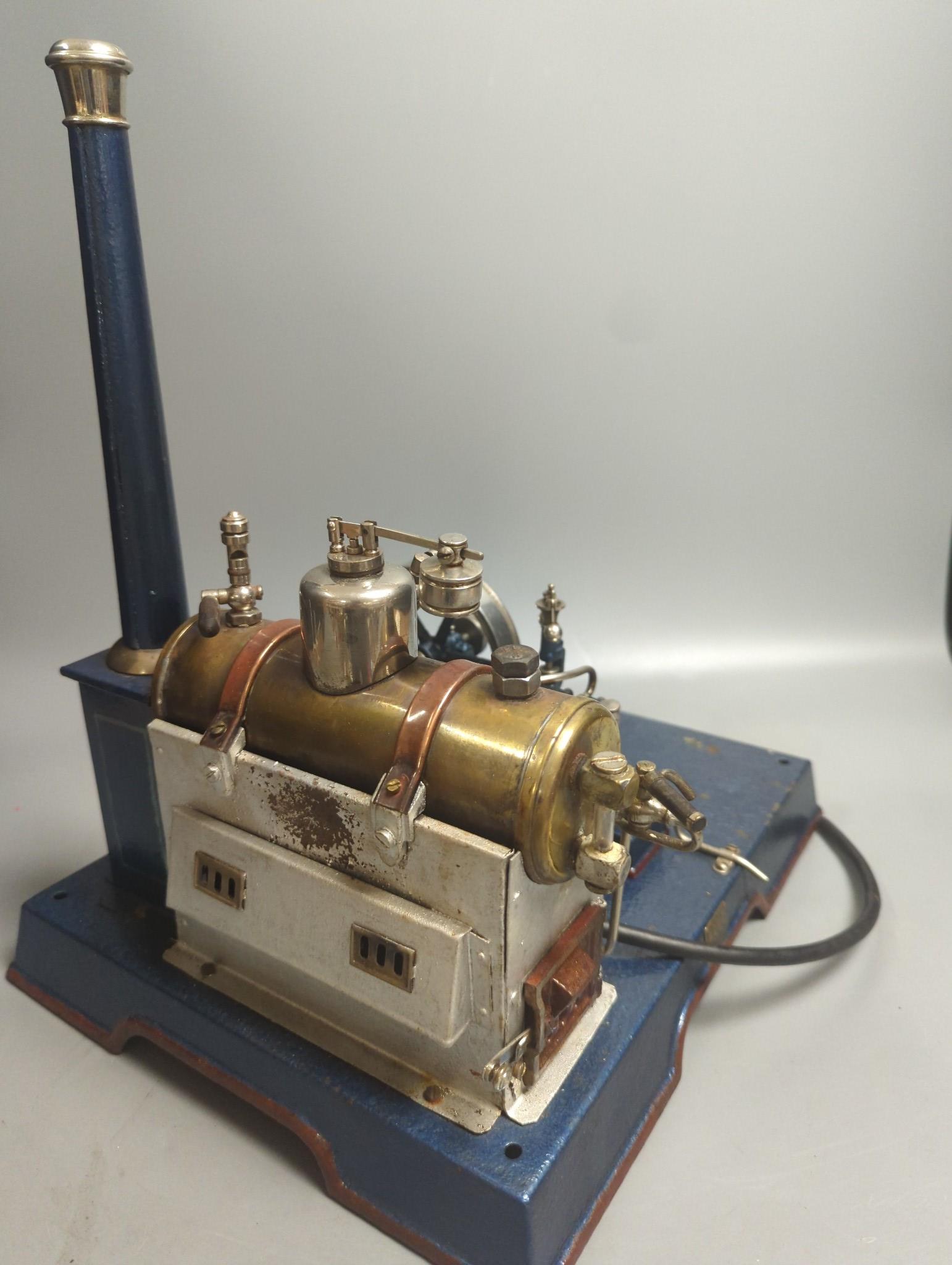 A Marklin spirit-fired live steam stationary engine with 10cm flywheel, 1920’s, and a smaller stationary engine